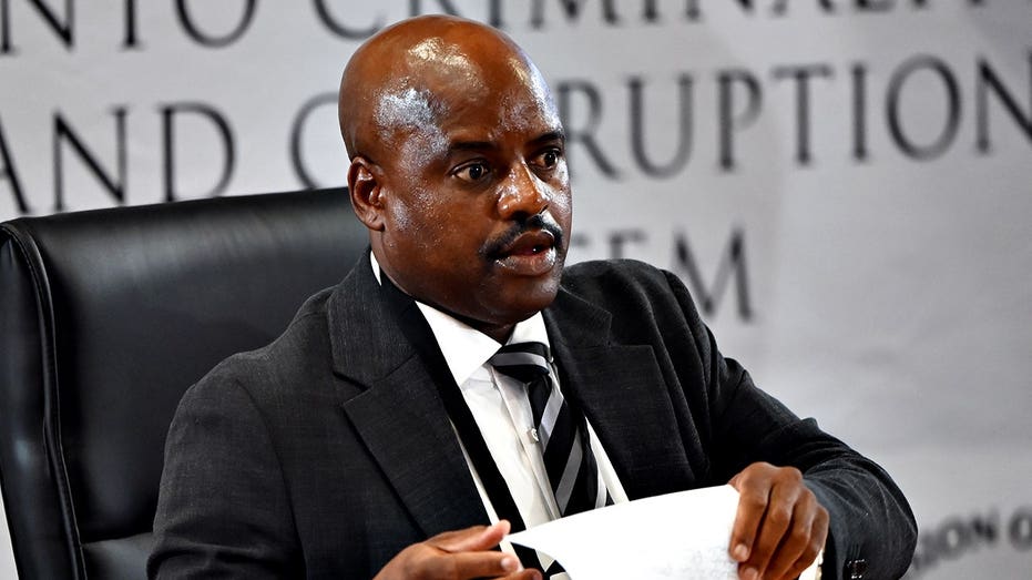South African ex-police chief gets tissue stuck on forehead while sweating during corruption inquiry Adelaide Accountant